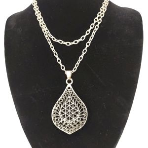 Long intricate pendant necklace